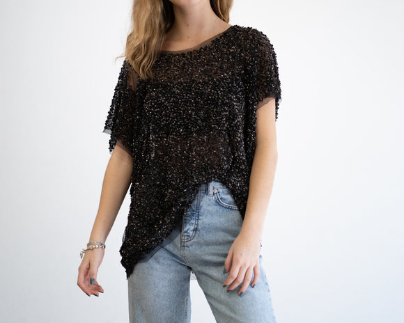 Blusa transparente con aplicaciones